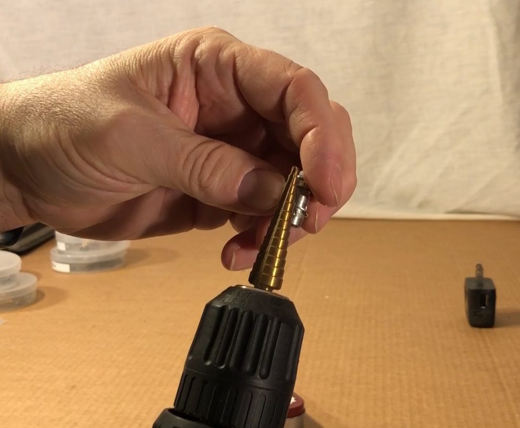 Measure the size needed on the step drill